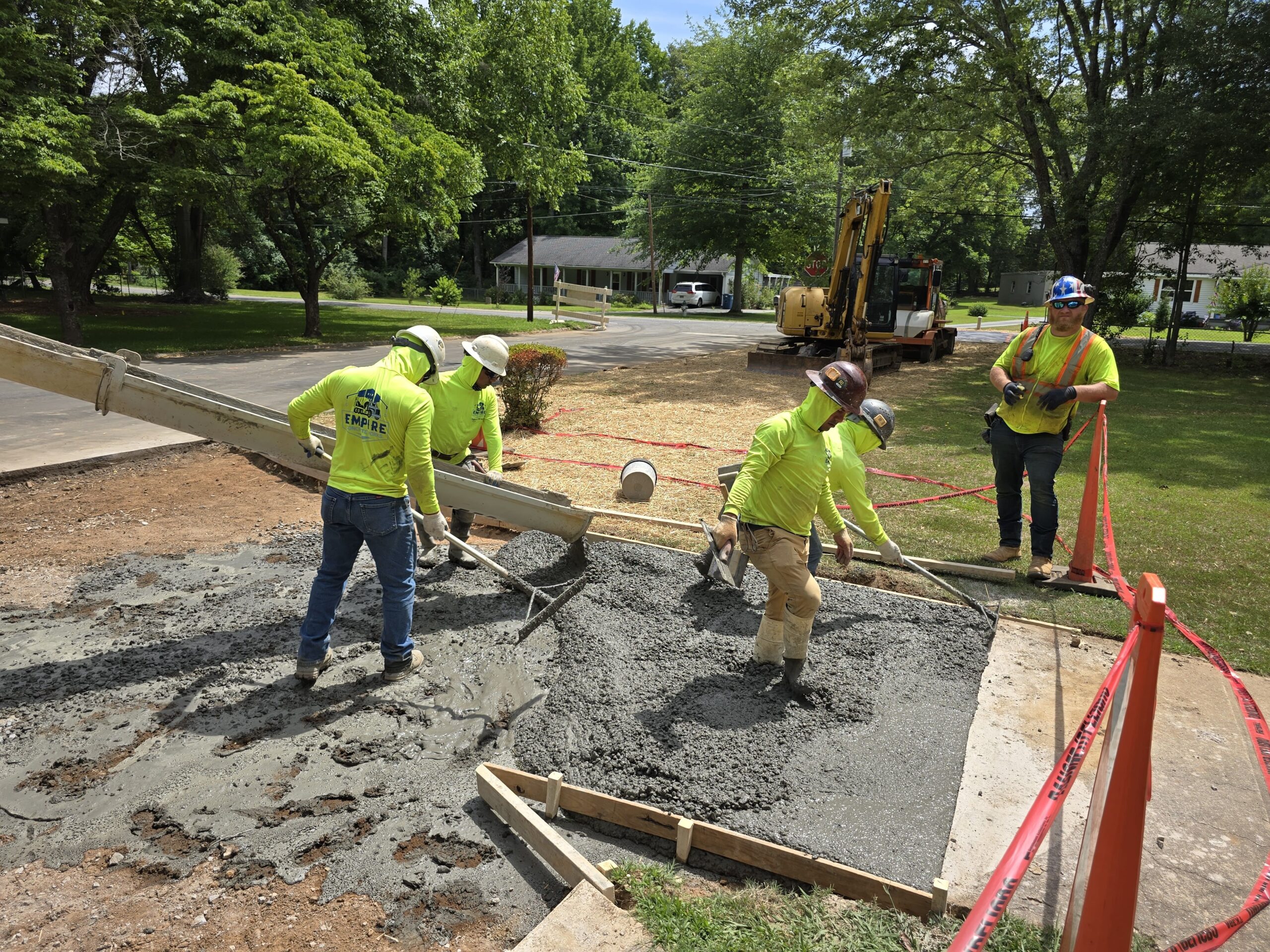 Professional team finishing a concrete patio